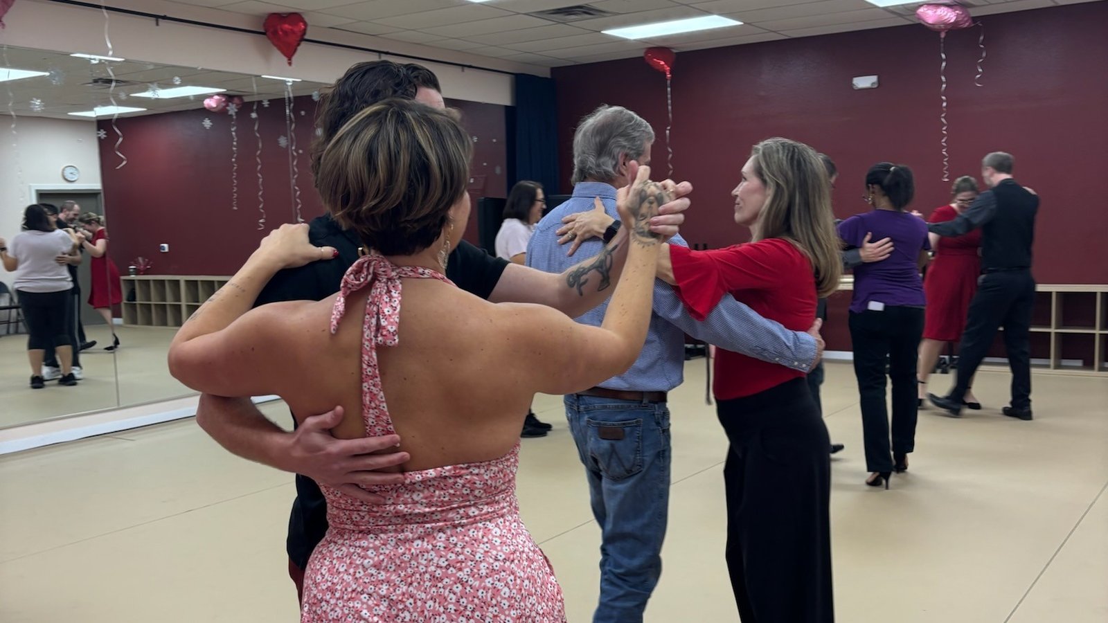 Couples dancing together on the B3 Dance studio floor at a ballroom social