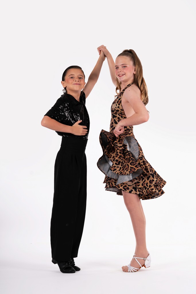 Two B3 Dance performers posing together in costume